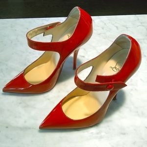 Red Christian Louboutin pointy toe heels